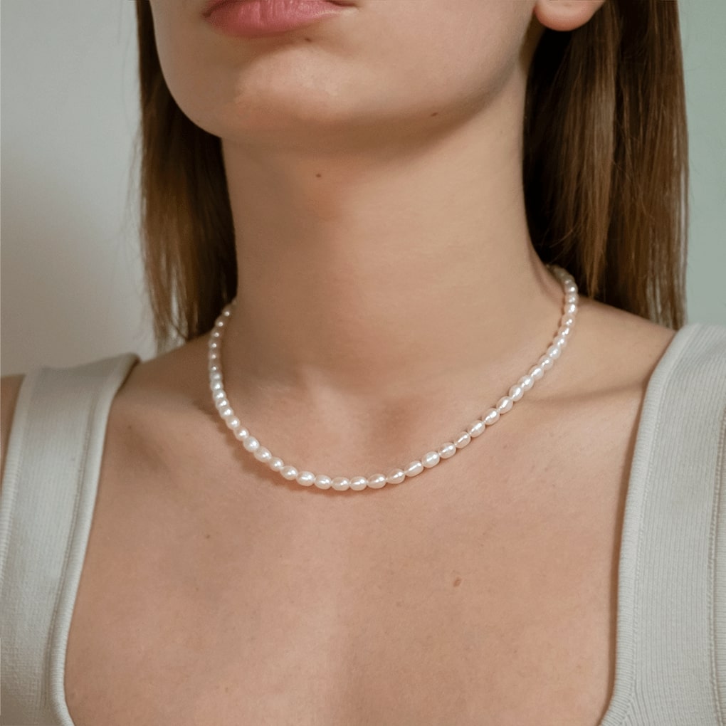 olive pearl necklace on model